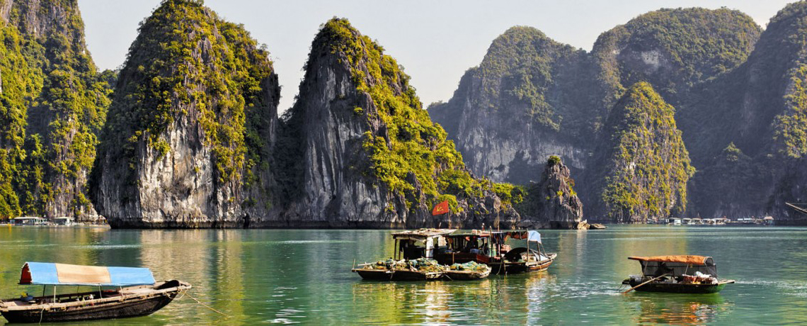 Unforgettable Trips Asia boats and mountainous islands